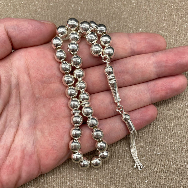 A prayer bead made of pure silver with a silver purity of 925, featuring medium-sized round beads intricately crafted with a thread of silver, meticulously designed to be a true piece of art