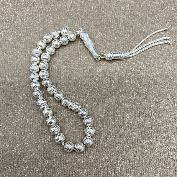 A pure silver rosary, 925 carats, with very small round beads intricately threaded with a silver thread, crafted with utmost care to become a true work of art