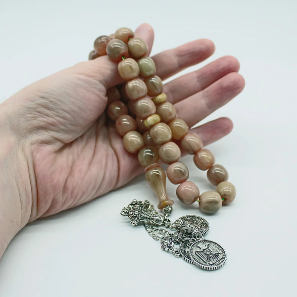 Aged Turkish musk rosary in light gray wavy bead size, medium size, woven with double propylene thread for greater durability and with a corkouche made of a mixture of antimony and metal.