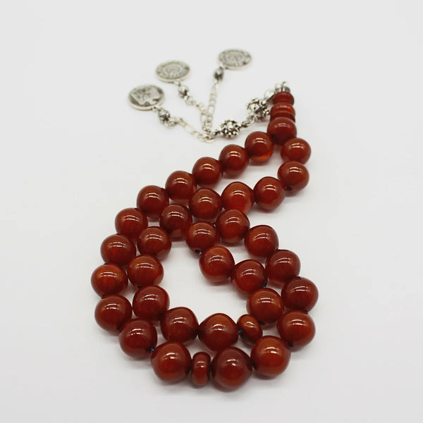 Aged Turkish musk rosary in dark honey wavy bead size, medium size, woven with double propylene thread for greater durability and with a cork of antimony and metal mixture