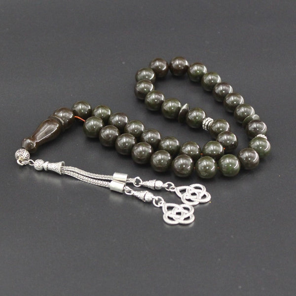 Sandalous musky rosary in dark olive color, a medium bead woven with strong fluorocarbon thread and a crochet made of a mixture of antimony and metal.