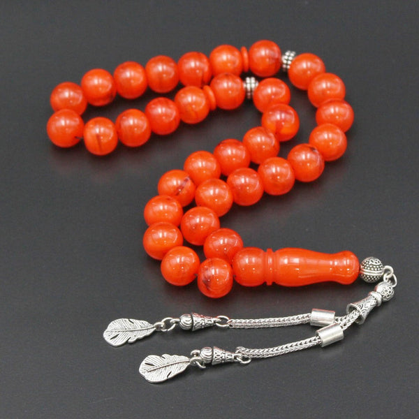 Musky molasses and rashi rosary in distinctive orange color, medium bead, woven with strong fluorocarbon thread and with a crochet made of a mixture of antimony and metal.