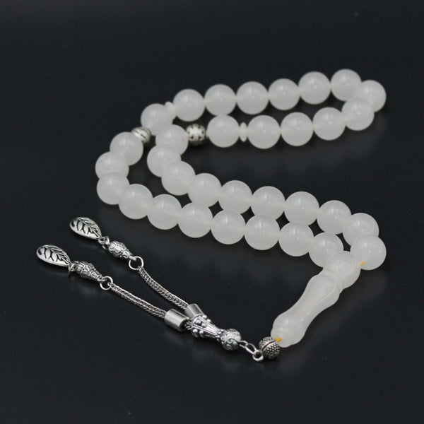 Turkish faturan rosary in soft white, medium bead, woven with strong fluorocarbon thread and with a tassel made of a mixture of antimony and metal.