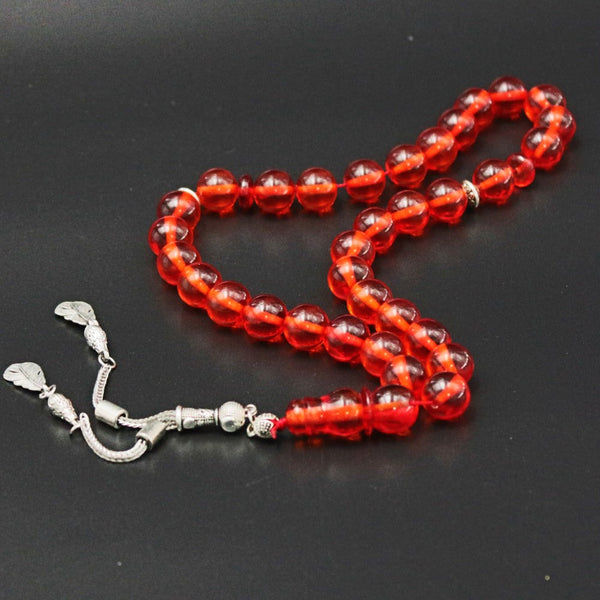 Turkish faturan rosary in transparent peach color, medium bead, woven with strong fluorocarbon thread and with a tassel made of antimony and metal.