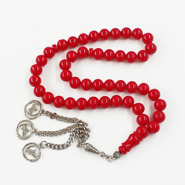 Aged musky sandalous rosary in a strong cherry red color, a soft bead woven with durable propylene thread and a crochet made of a mixture of antimony and metal.