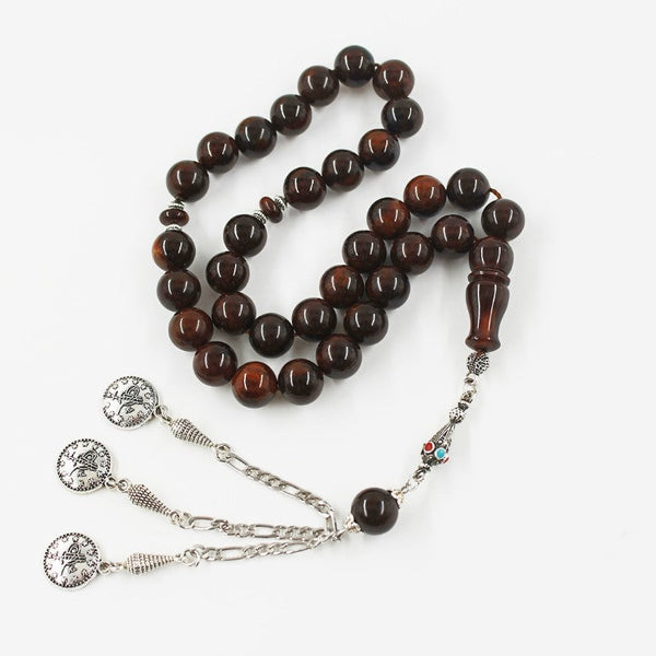 Aged musky sandalous rosary in luxurious black, medium bead woven with durable propylene thread and with a karakosha made of a mixture of antimony and metal.